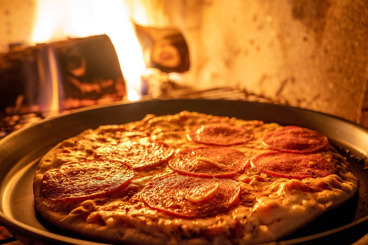 Dove si mette il fuoco nel forno per la pizza e perché proprio lì